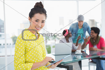 Young creative woman using her tablet