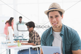 Young creative man using his tablet