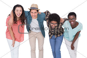 Stylish friends smiling at camera together