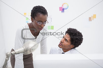 Business team using computer together
