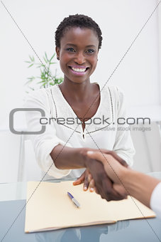 Smiling businesswoman introduced her new colleague