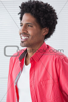 Smiling casual businessman standing and posing