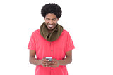 Smiling man with scarf text messaging