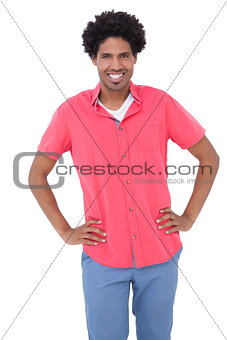 Happy man posing with hands on hips