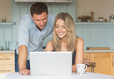 Cute couple using laptop together