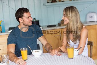 Cute couple having breakfast together