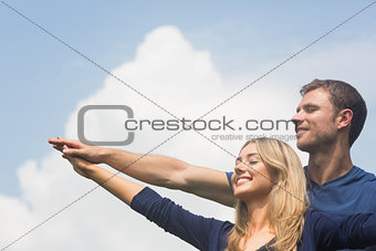 Cute couple smiling together on sunny day