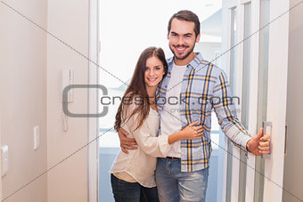 Cute couple walking through the door