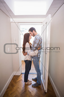 Cute couple standing in the hall