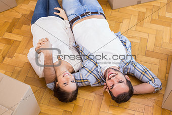 Cute couple lying on the floor