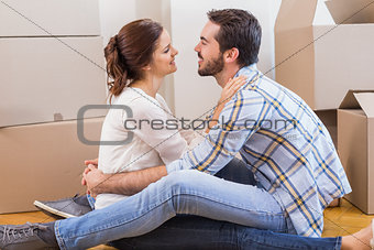 Cute couple sitting on the floor