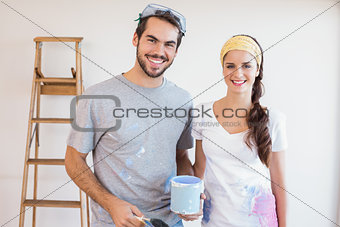 Cute couple redecorating living room
