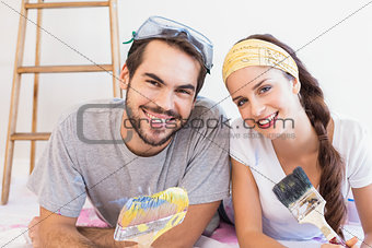 Cute couple redecorating living room