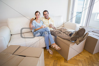 Young couple taking a break from unpacking
