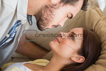 Cute couple lying on couch