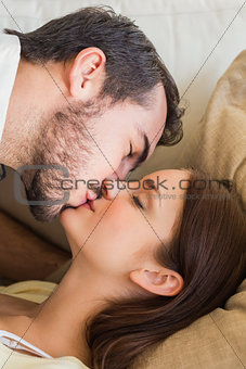 Cute couple kissing on couch