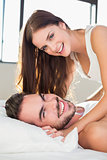 Young couple having fun in bed
