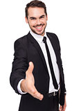 Portrait of smiling businessman offering handshake