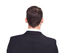 Rear view of businessman in suit standing