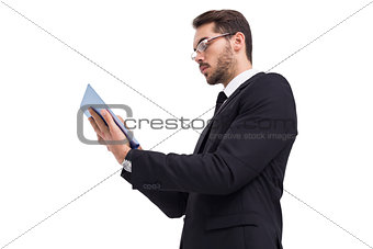 Businessman with glasses using his tablet