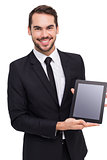 Smiling businessman showing his tablet pc