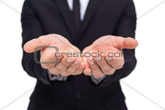 Mid section of a businessman gesturing
