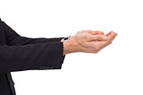 Businessman with arms out presenting something