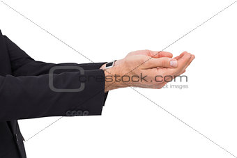Businessman with arms out presenting something