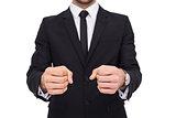 Elegant businessman in suit clenching his fists