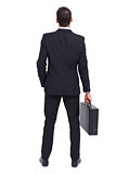 Rear view of businessman holding a briefcase