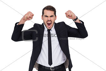 Furious businessman tensing arms muscle