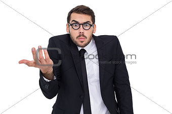 Doubtful businessman with glasses gesturing