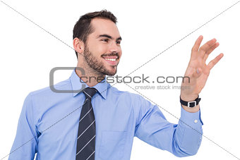 Happy businessman catching something with his hand