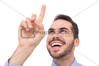 Happy businessman pointing something up