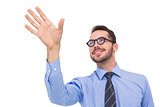 Smiling businessman standing with fingers spread out