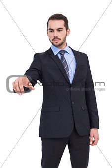 Cheerful businessman pointing at camera