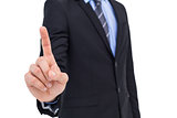 Mid section of businessman pointing something up