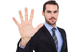 Smiling businessman with fingers spread out