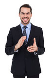 Happy businessman standing and applauding