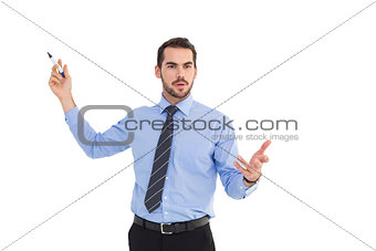 Businessman speaking and gesturing with marker