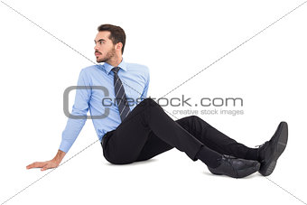 Businessman in shirt sitting on floor
