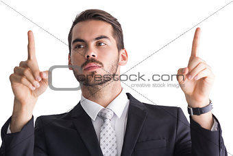 Concentrated businessman in suit measuring something