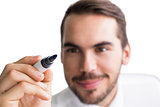 Portrait of happy businessman writing with marker