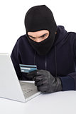 Angry hacker using laptop and credit card