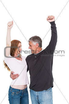 Casual couple cheering and smiling