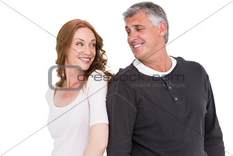 Casual couple smiling at each other