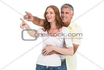 Casual couple smiling and pointing