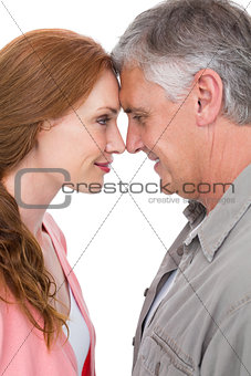 Casual couple smiling at each other