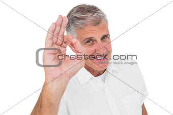 Casual man showing ok sign to camera