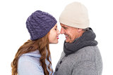 Couple in warm clothing facing each other